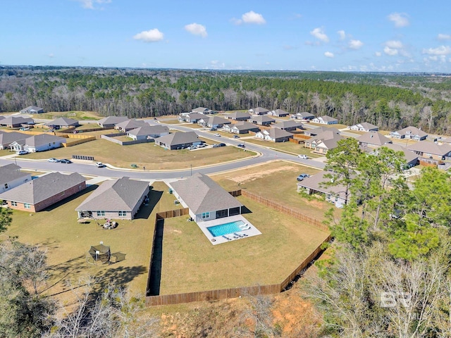 bird's eye view with a residential view and a view of trees