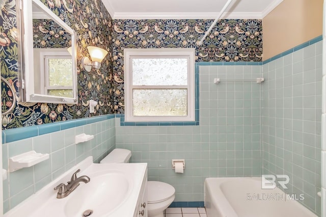 bathroom with a wainscoted wall, wallpapered walls, ornamental molding, tile patterned floors, and toilet