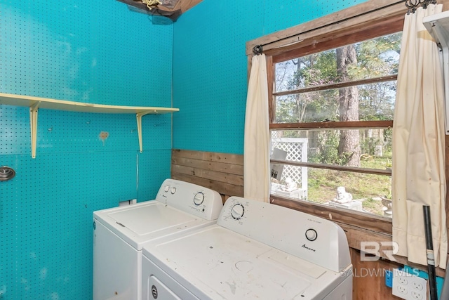 clothes washing area featuring laundry area and separate washer and dryer