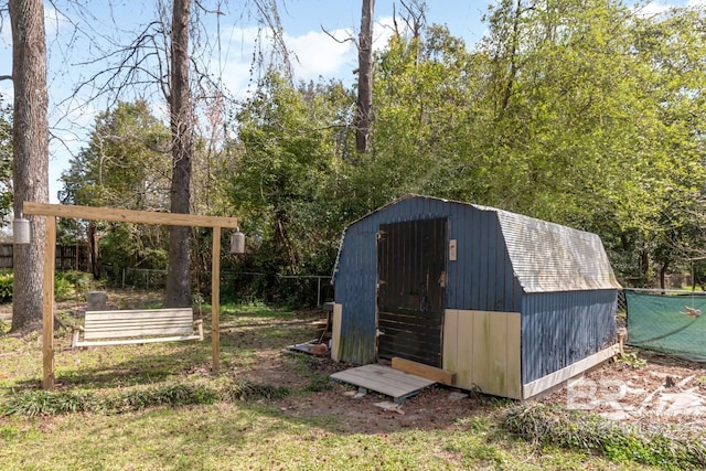 view of shed with fence