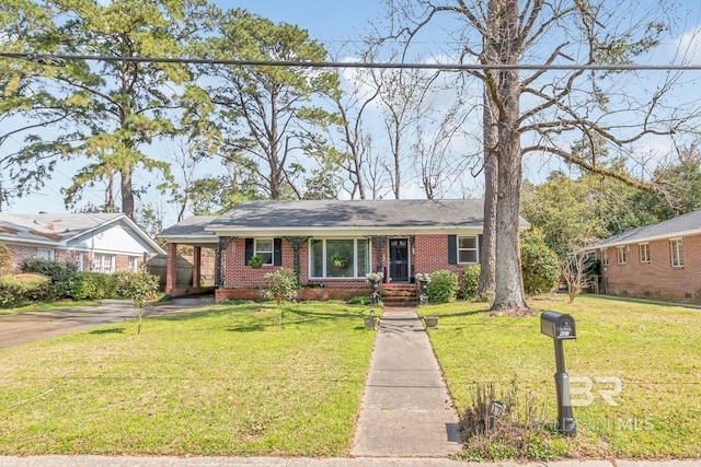 ranch-style house with brick siding and a front lawn