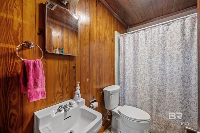 full bathroom featuring wooden walls, wooden ceiling, toilet, and a shower with curtain