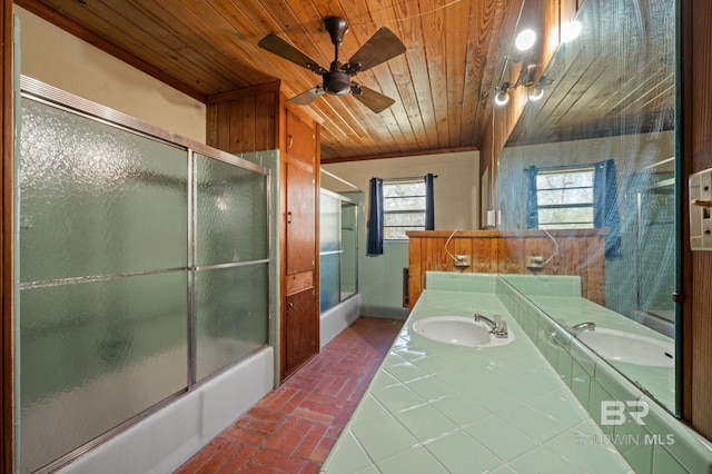 full bath featuring a sink, bath / shower combo with glass door, wood ceiling, and brick floor