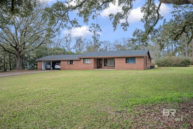 ranch-style house with an attached carport, brick siding, a front lawn, and driveway