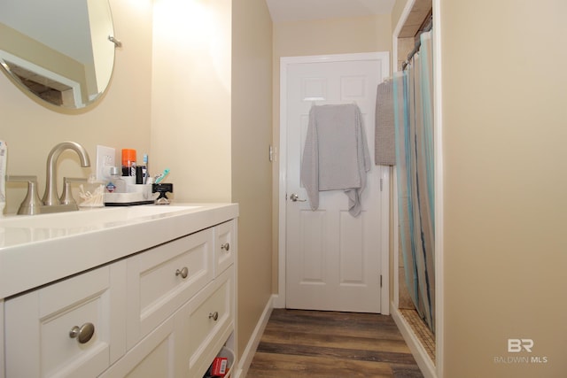 bathroom featuring vanity, hardwood / wood-style floors, and a shower with shower curtain