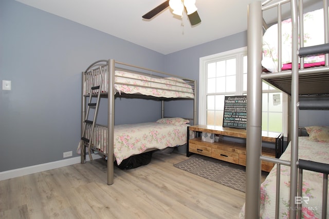 bedroom featuring ceiling fan and light hardwood / wood-style flooring