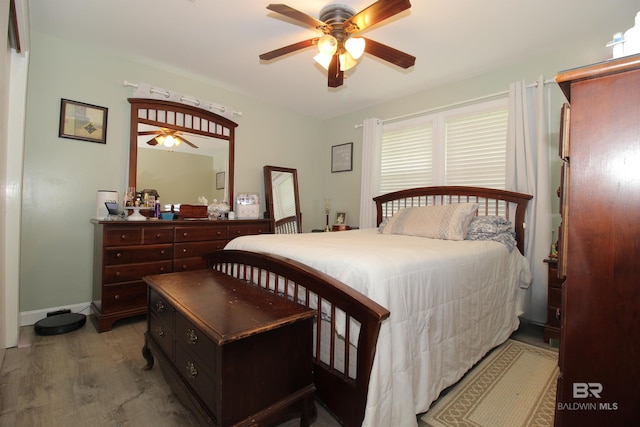 bedroom featuring ceiling fan and light wood-type flooring