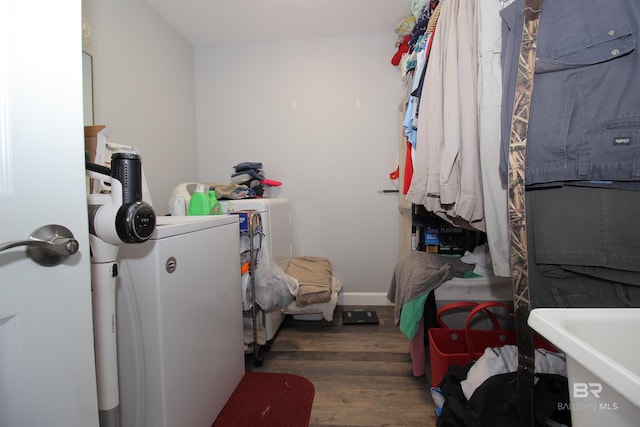 interior space featuring dark wood-type flooring and independent washer and dryer