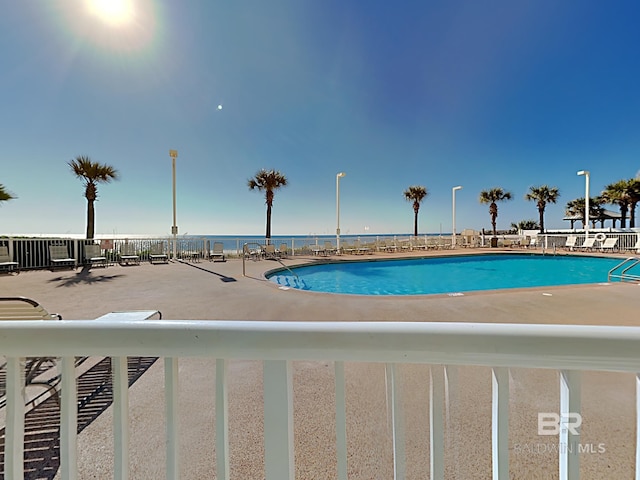 community pool featuring a patio area