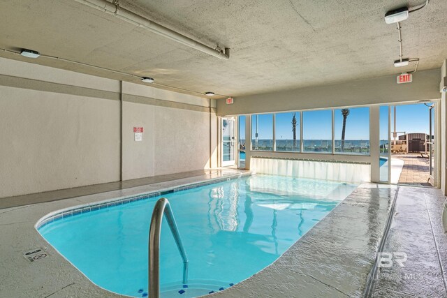 community pool with a patio area