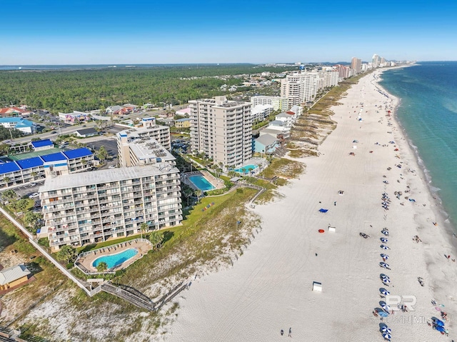 bird's eye view featuring a water view, a view of city, and a beach view