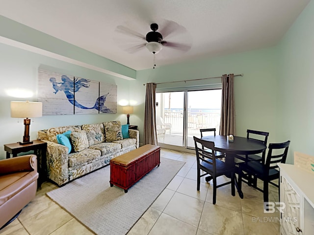 living room with a ceiling fan and light tile patterned floors