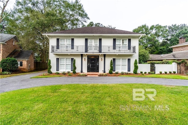 656 Falls Church Rd, Mobile, AL 36608 - view of front of property with a front yard and a balcony