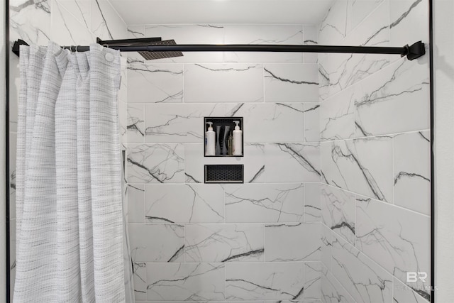 interior details with a shower with curtain