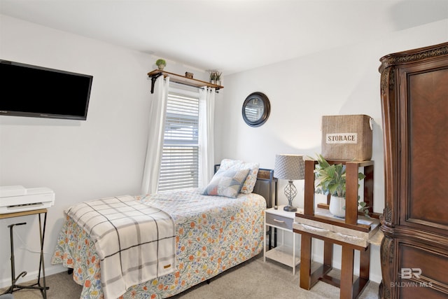 bedroom featuring light carpet