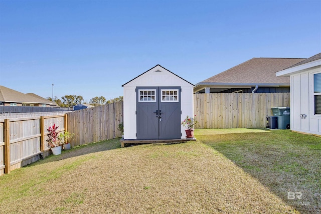 view of outbuilding featuring a yard