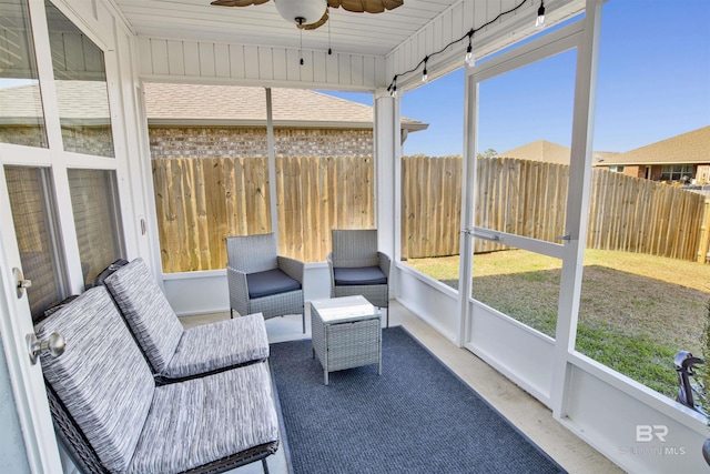 sunroom / solarium with ceiling fan and a healthy amount of sunlight