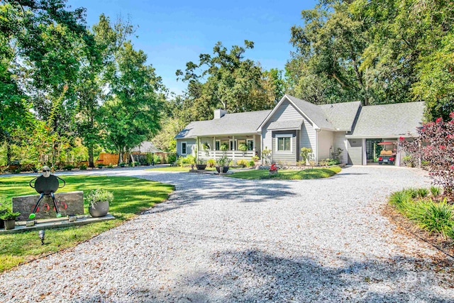 single story home with a front yard and a porch