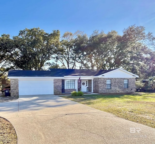 ranch-style home featuring a garage and a front yard