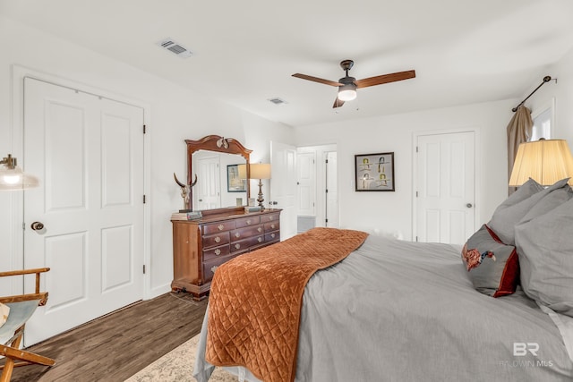 bedroom featuring dark hardwood / wood-style floors and ceiling fan