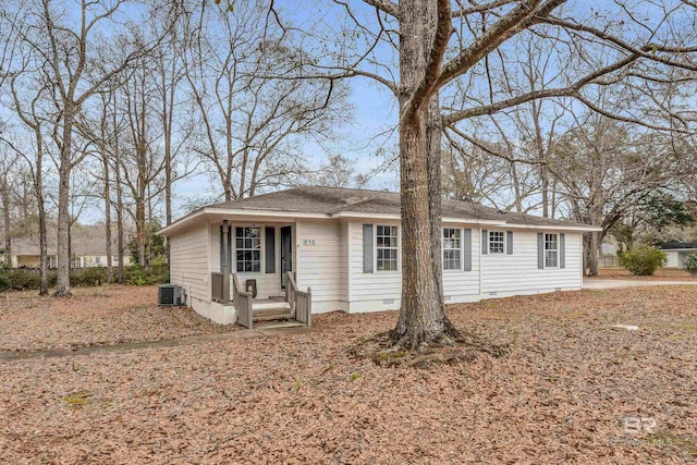 ranch-style home featuring central AC unit