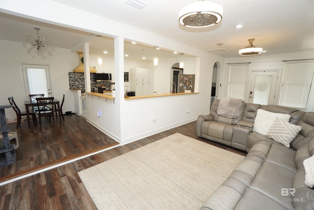 living room featuring dark wood-type flooring