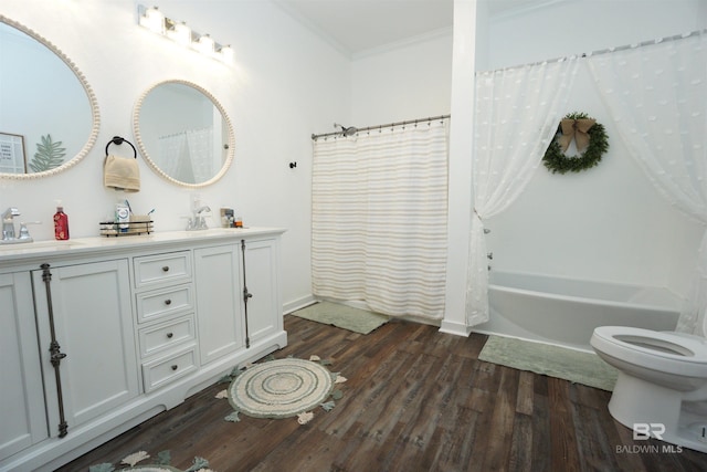 full bathroom featuring vanity, shower / tub combo with curtain, crown molding, wood-type flooring, and toilet