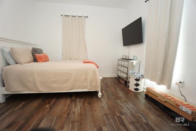 bedroom featuring dark hardwood / wood-style floors