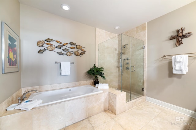 bathroom with tile patterned flooring and separate shower and tub