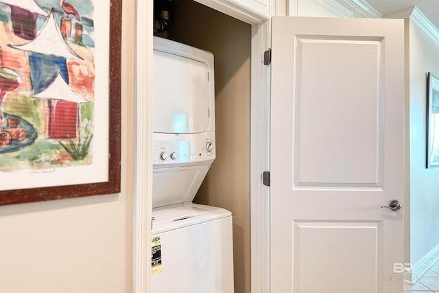 laundry area with stacked washer and clothes dryer