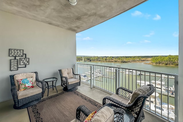 balcony featuring a water view