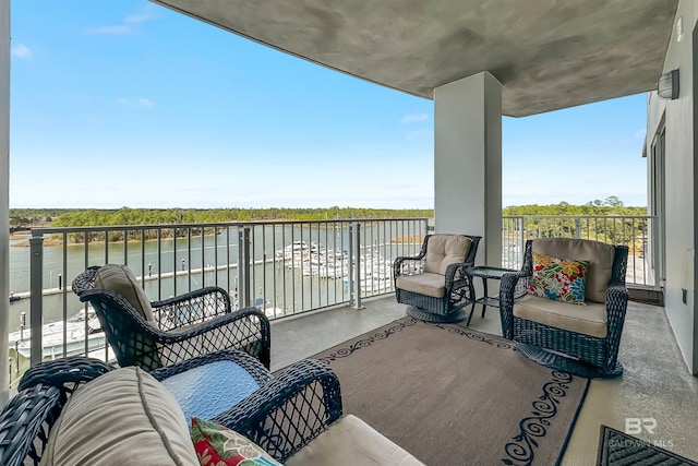 balcony featuring a water view