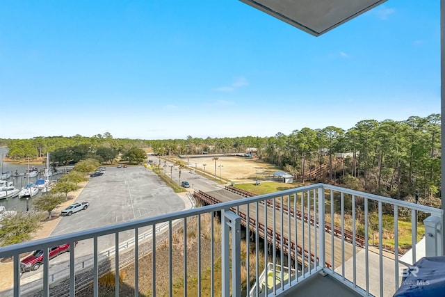 balcony featuring a water view