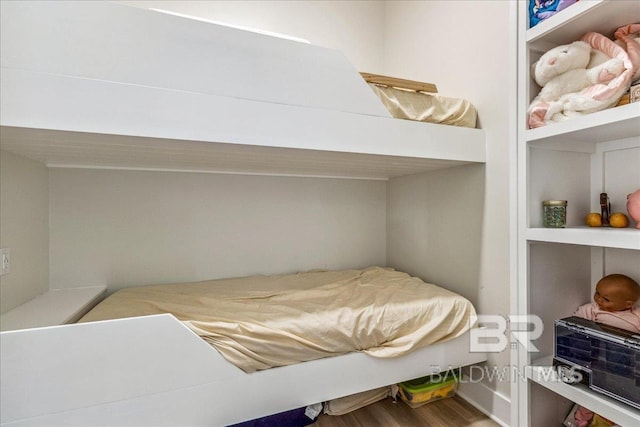 bedroom with wood finished floors