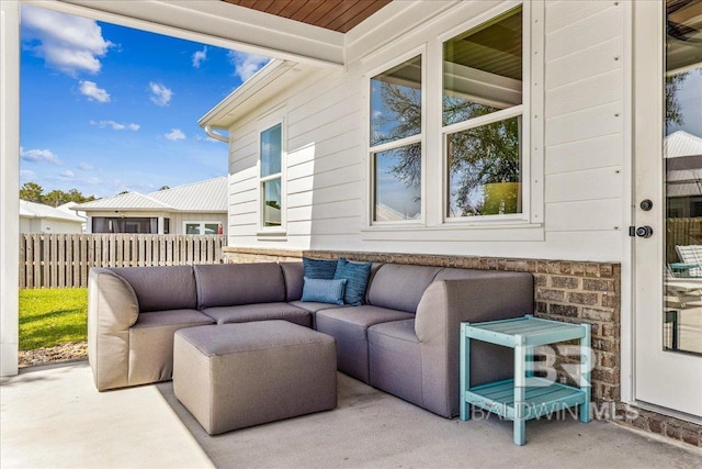 view of patio featuring fence and outdoor lounge area