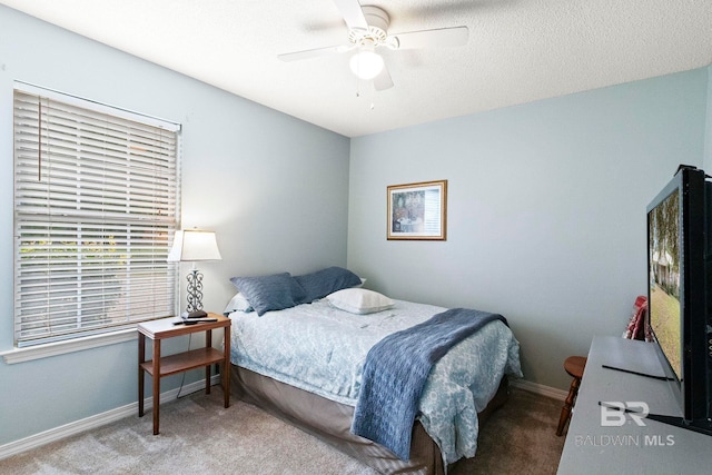 bedroom with ceiling fan and carpet floors