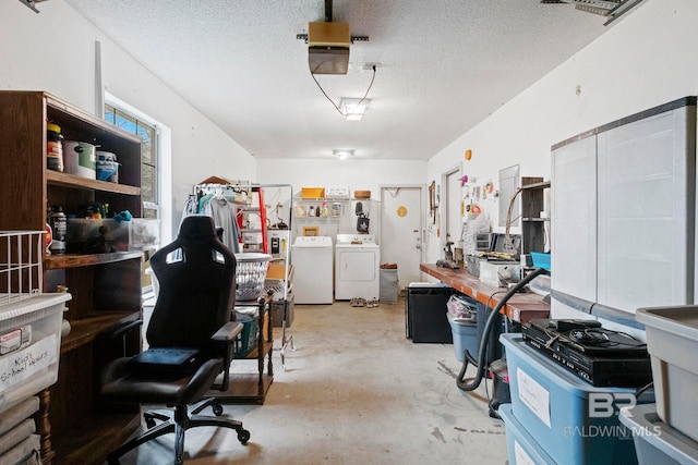 garage featuring separate washer and dryer and a garage door opener