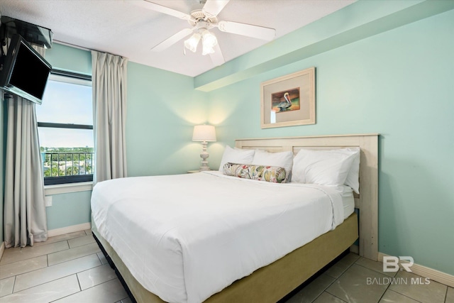 tiled bedroom with ceiling fan