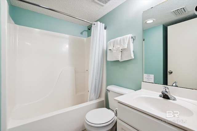 full bathroom featuring vanity, toilet, a textured ceiling, and shower / tub combo with curtain