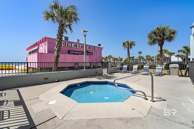 view of swimming pool with a water view