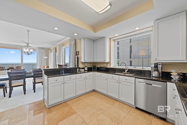 13621 Perdido Key Dr Unit 1804W, Perdido Key, FL 32507 - kitchen featuring white cabinetry, a water view, sink, stainless steel dishwasher, and a raised ceiling