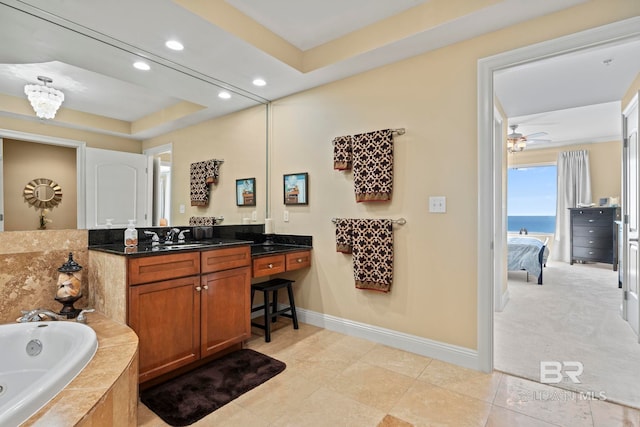13621 Perdido Key Dr Unit 1804W, Perdido Key, FL 32507 - bathroom with vanity, a water view, a tray ceiling, ceiling fan, and tile patterned floors