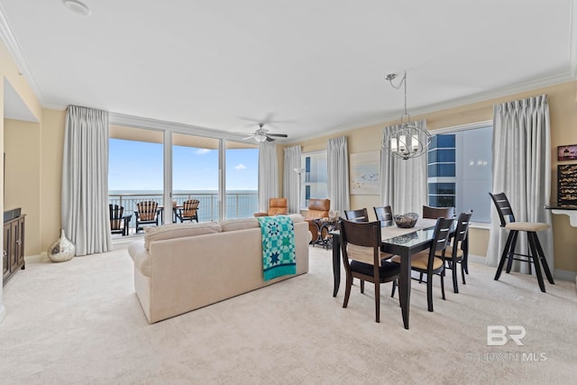 13621 Perdido Key Dr Unit 1804W, Perdido Key, FL 32507 - carpeted dining space featuring ceiling fan with notable chandelier, a water view, crown molding, and expansive windows