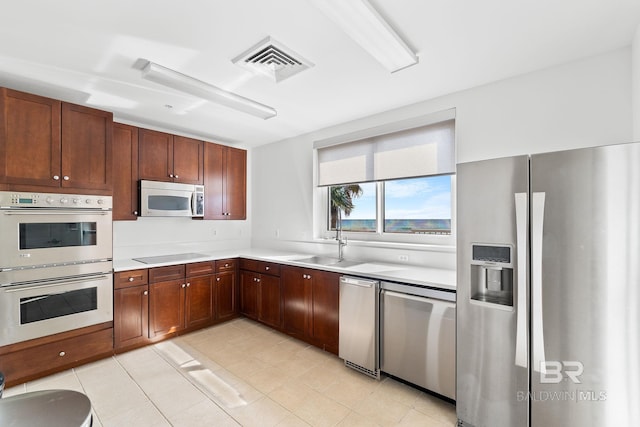 13621 Perdido Key Dr Unit 1804W, Perdido Key, FL 32507 - kitchen featuring sink, appliances with stainless steel finishes, and light tile patterned flooring