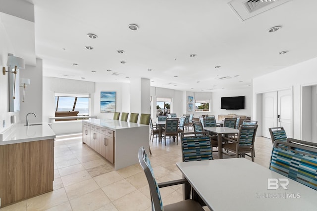13621 Perdido Key Dr Unit 1804W, Perdido Key, FL 32507 - kitchen with sink, a kitchen island, and light tile patterned floors