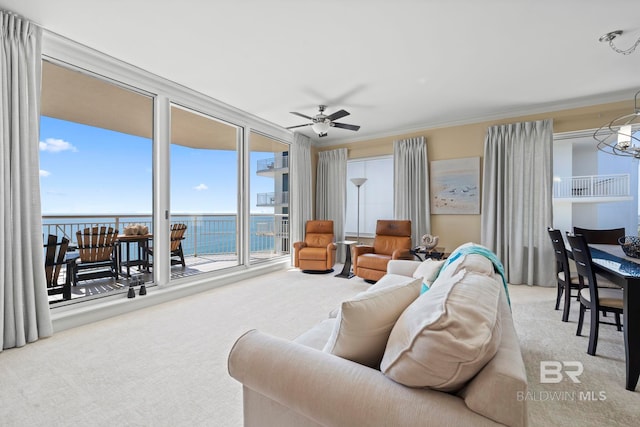 13621 Perdido Key Dr Unit 1804W, Perdido Key, FL 32507 - living room featuring a water view, expansive windows, ceiling fan with notable chandelier, ornamental molding, and light colored carpet