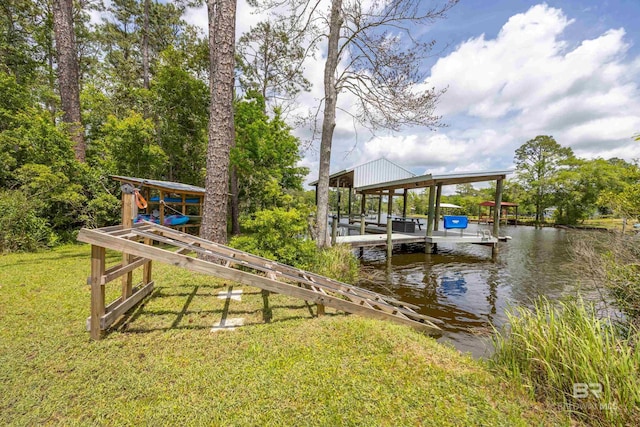 dock area featuring boat lift, a water view, and a lawn