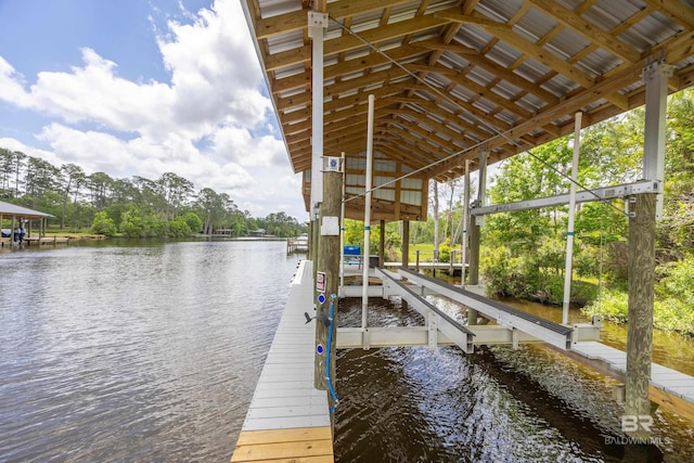 view of dock with a water view and boat lift