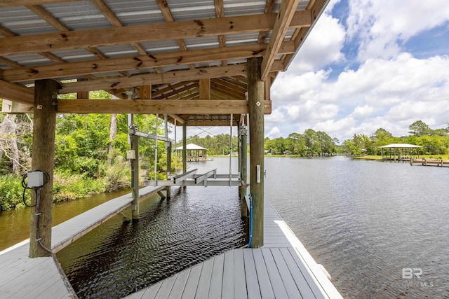 view of dock with boat lift and a water view