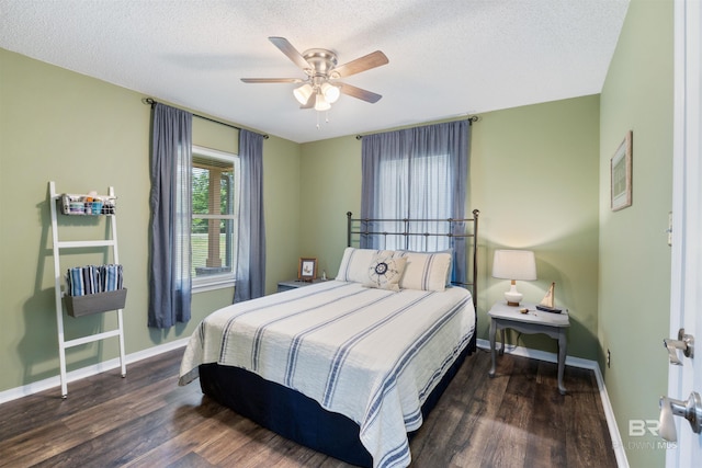 bedroom with a textured ceiling, wood finished floors, baseboards, and ceiling fan